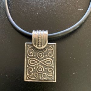 Sterling silver Egyptian pendant and leather chain.